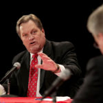 GOP candidates U.S. Rep. Mike Simpson, left, debates challenger Bryan Smith at Canyon Ridge High School on April 25, 2014 in Twin Falls, Idaho. The 2nd Congressional Representative GOP debate Friday night hosted by the (Twin Falls) Times-News was the first of two debates for this race in Idaho.(AP Photo/Times-News, Ashley Smith)