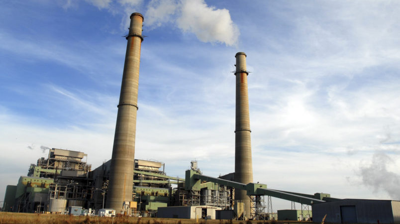 **ADVANCE FOR WEEKEND EDITIONS, DEC. 1-2** Smoke stacks from the NRG power plant located just outside of Jewett, Texas tower over Texas Highway 39, Nov. 28, 2007. The plant provides 250 full-time jobs for Limestone county. Jewett is one of four towns, two in Texas and two in Illinois, competing for the new state-of-the-art FutureGen power plant developers say would emit almost no pollution, turning coal into gas while capturing and storing climate-changing carbon dioxide deep underground. (AP Photo/Nick Simonite)