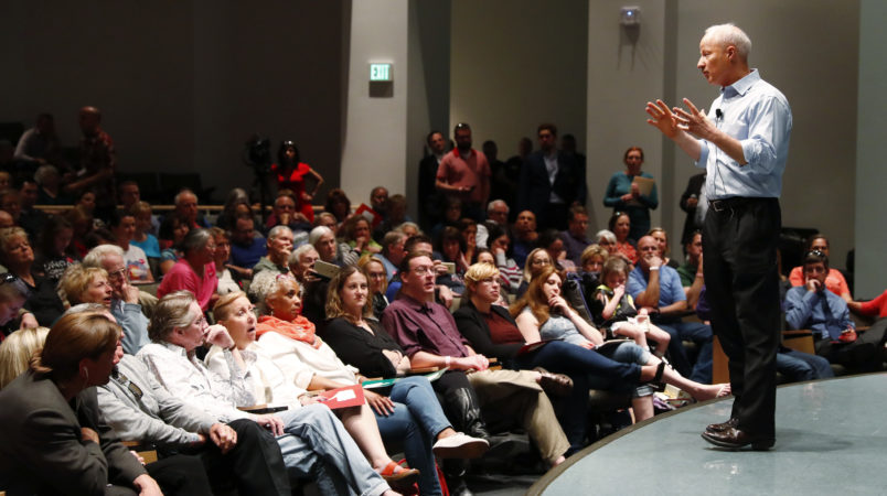 U.S. Rep. Mike Coffman, R-Colo., addresses constituents during a town hall meeting in a hall on the campus of the University of Colorado Medical School late Wednesday, April 12, 2017, in Aurora, Colo. Town halls have become a risky proposition for GOP members of Congress since the election of President Donald Trump. (AP Photo/David Zalubowski)