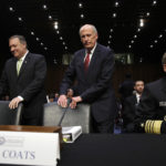 CIA Director Mike Pompeo, left, and Director of National Intelligence Dan Coats, take their seats next to National Security Agency Director Adm. Michael Rogers, during a Senate Intelligence Committee hearing, on Capitol Hill in Washington, Thursday, May 11, 2017. It is an annual hearing about the major threats facing the U.S., but former FBI Director Jim Comey's sudden firing is certain to be a focus of questions. (AP Photo/Jacquelyn Martin)