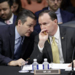 Conservative members of the Senate Judiciary Committee, Sen. Ted Cruz, R-Texas, left, and Sen. Mike Lee, R-Utah, confer as the Republican-led panel meets to advance the nomination of President Donald Trump's Supreme Court nominee Neil Gorsuch to fill the vacancy left by the late Antonin Scalia, on Capitol Hill in Washington, Monday, April 3, 2017. A weeklong partisan showdown is expected as Democrats are steadily amassing the votes to block Judge Gorsuch and force Republicans to unilaterally change long-standing rules to confirm him. (AP Photo/J. Scott Applewhite)