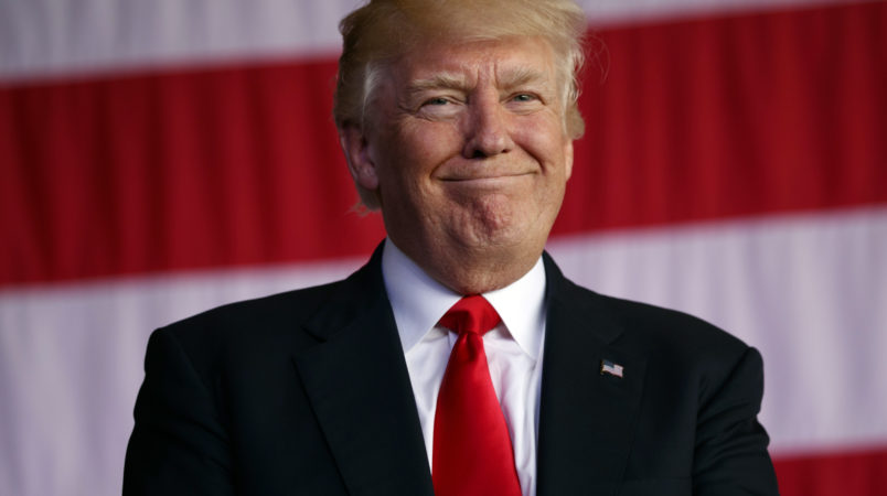 President Donald Trump smiles as he is introduced to speak to U.S. military troops and their families at Naval Air Station Sigonella, Saturday, May 27, 2017, in Sigonella, Italy. (AP Photo/Evan Vucci)