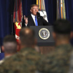 President Donald Trump speaks at Fort Myer in Arlington Va., Monday, Aug. 21, 2017, during a Presidential Address to the Nation about a strategy he believes will best position the U.S. to eventually declare victory in Afghanistan. (AP Photo/Carolyn Kaster)