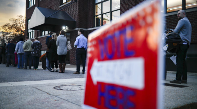 Voter wait in line outside a polling place at the Nativity School on Election Day Tuesday Nov. 8 2016 in Cincinnati
