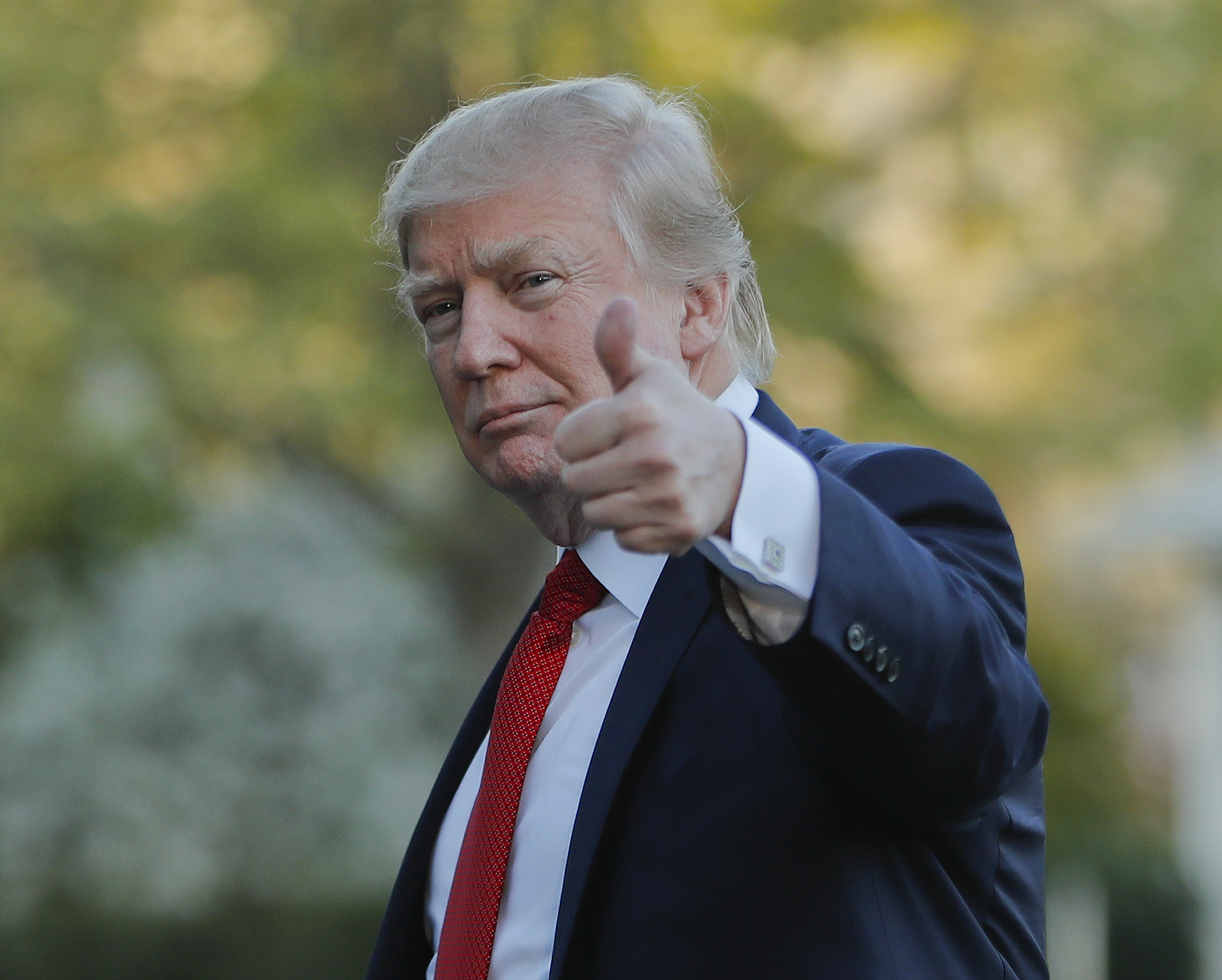President Donald Trump gives a 'thumbs-up' as he walks across the South Lawn of the White House in Washington, Sunday, April 9, 2017. Trump is returning from a trip to his Mar-a-Lago estate in Palm Beach, Fla. (AP Photo/Pablo Martinez Monsivais)