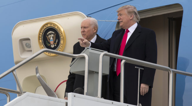 President Donald Trump stands with Sen. Orrin Hatch R-Utah after arriving at Salt Lake City International Airport Monday Dec. 4 2017 in Salt Lake City